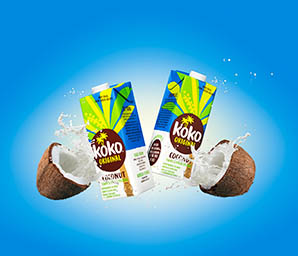 Coloured background Explorer of Koko milk cartons with smashing coconuts and milk splash