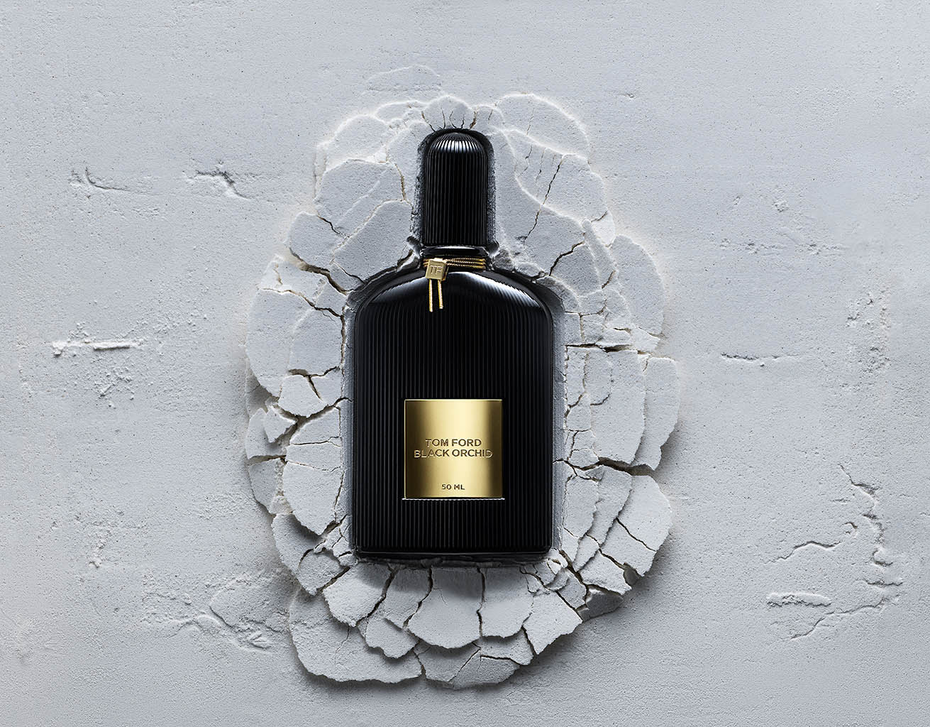 Creative Still Life Product Photography and Retouching of Tom Ford Black Orchid fragrance bottle by Packshot Factory