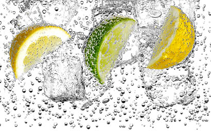 Liquid / Smoke Photography of Lemons and lime in water with ice and bubbles