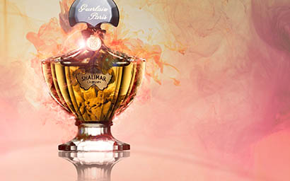 Fragrance Explorer of Guerlain Shalimar perfume bottle and smoke